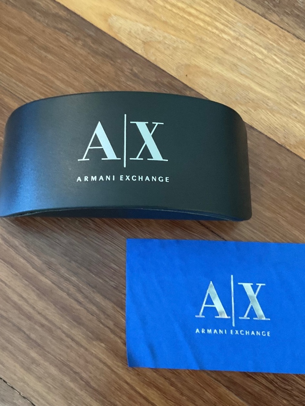 Armani Exchange sunglasses case with branded soft cleaning cloth